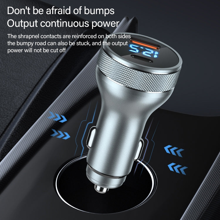 Silver car charger with dual ports and blue digital output display on base