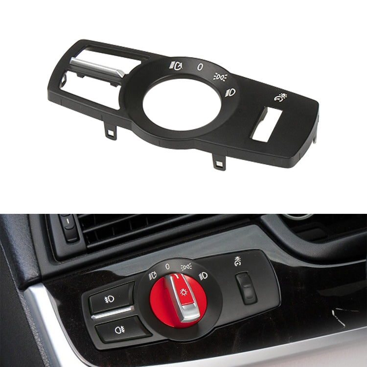 Black headlight switch panel with circular dial, indicator icons, and light switch buttons