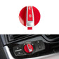Red headlight switch knob on car dash, with silver light icon dial