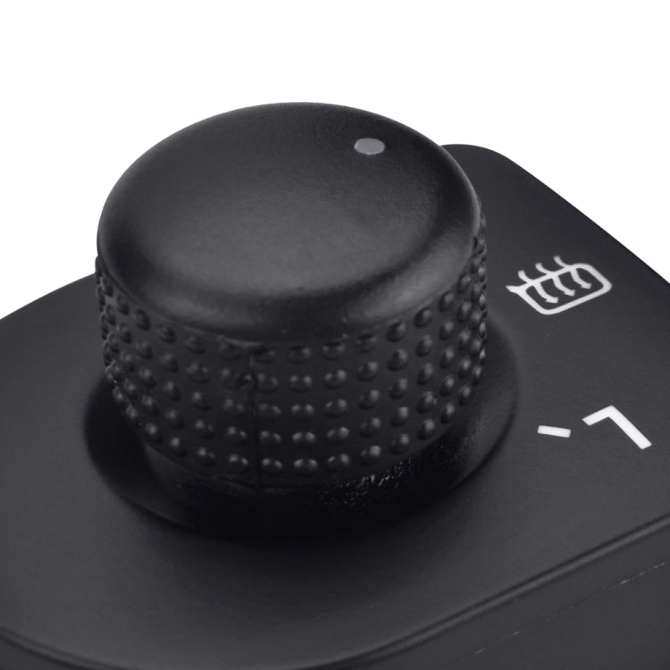 Black textured mirror control knob with heating icon and indicator marks