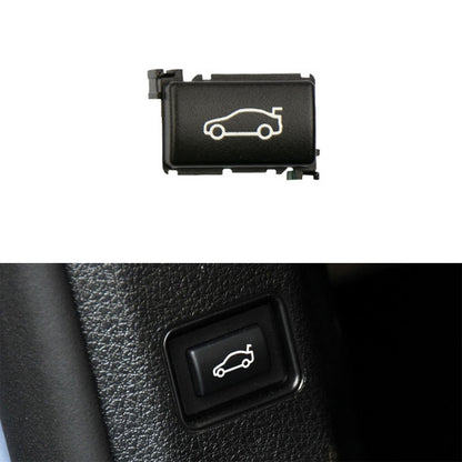 Black car trunk switch button with white outline car icon, rectangular rocker