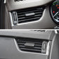Installed black air vent control paddle in dashboard grille