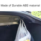 Installed black trunk grocery bag hook holding two plastic grocery bags