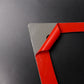 Black air outlet panel sticker corner with exposed red backing adhesive layer
