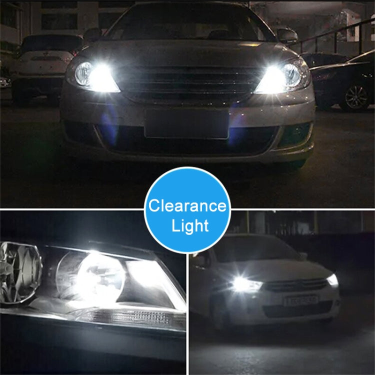 Two glowing T10 LED clearance bulbs shining on a car front at night