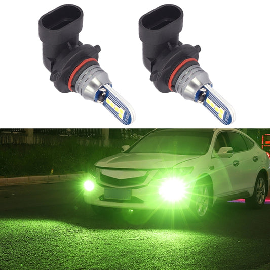 Pair of black 9006 LED fog light bulbs with blue LED circuit boards and red ring.
