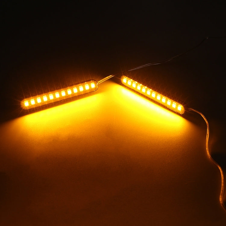 Lit 12-LED motorcycle license plate lights glowing amber-yellow