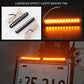 Motorcycle license plate light bars installed and glowing amber with 12 LED rows
