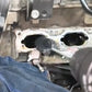 Carbon removal brush cleaning an engine intake port with black bristles
