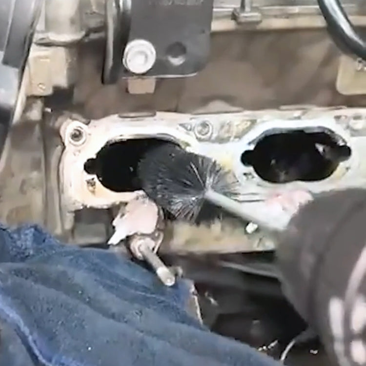 Carbon removal brush cleaning an engine intake port with black bristles