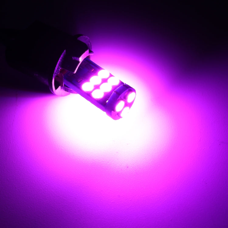 Glowing pair of T10 LED clearance bulbs with pink light output