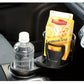 Black universal car cup holder with adjustable grip ring, holding a plastic bottle