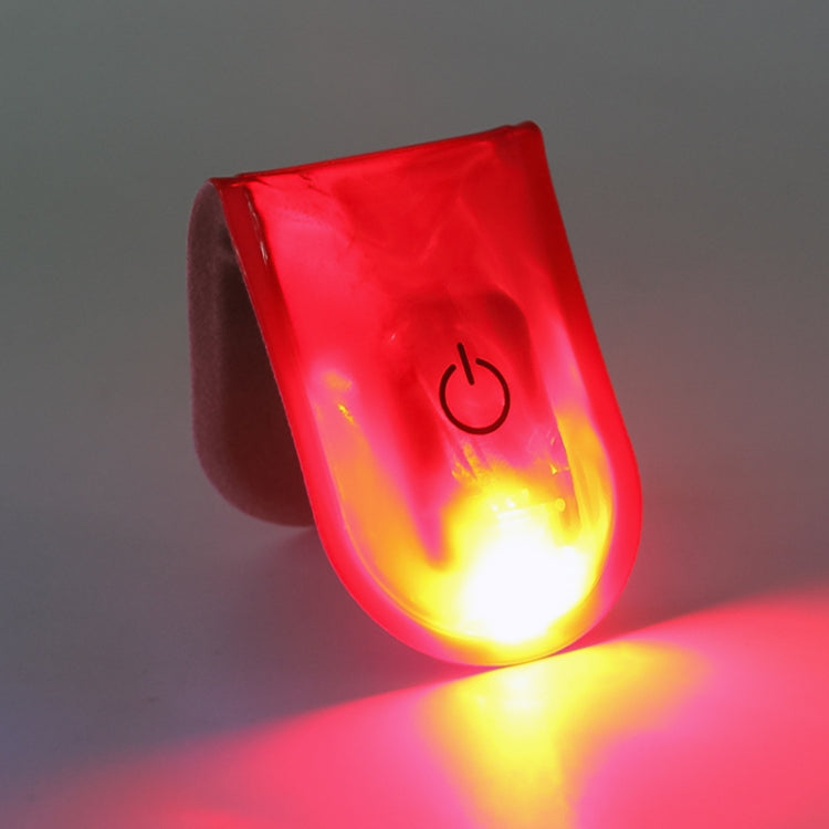 Red LED magnet clip safety light glowing orange-yellow, power icon visible