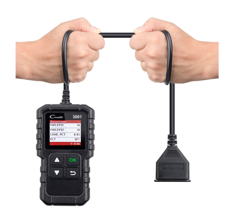 OBD2 diagnostic tool held by hands with OBD connector cable