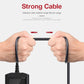 OBD2 code reader cable with plug ends held in hands, black