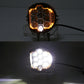 LED headlight showing amber ring and bright white beam in dark conditions
