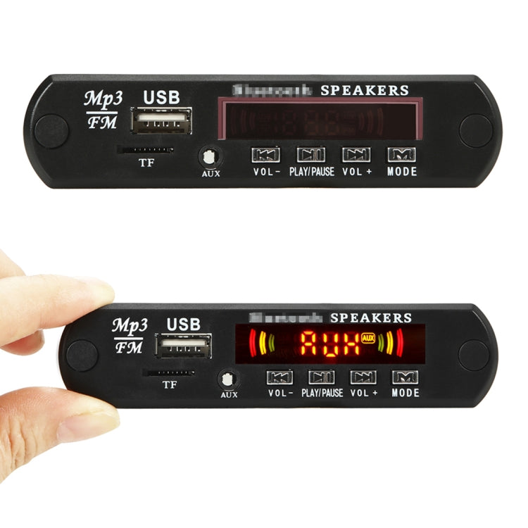 Car audio MP3 decoder board with USB and TF slots; finger touching the front panel
