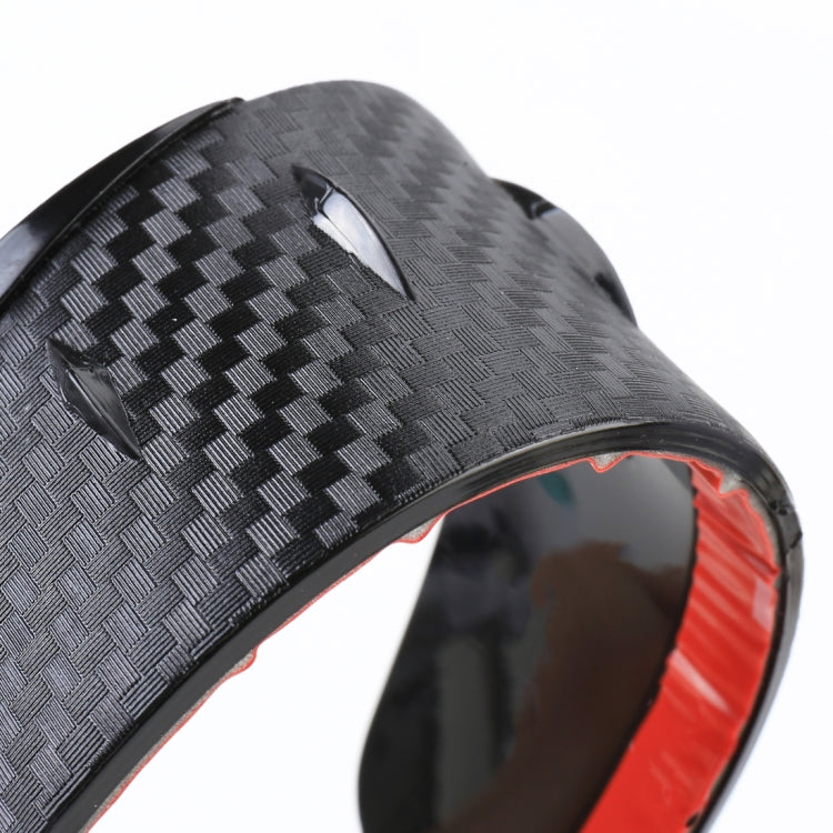Close-up of black carbon-textured rearview mirror rain blade cover