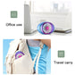 Portable car vent fan with blue-and-purple LED grille, placed on desk near bag