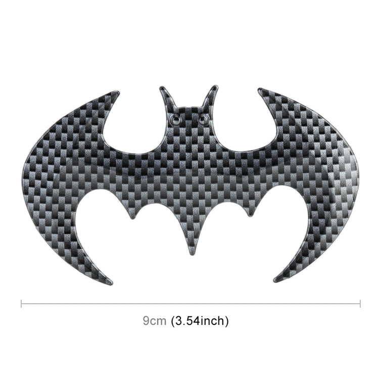 Bat-shaped metal car sticker, dark gray carbon-fiber design with small mounting holes