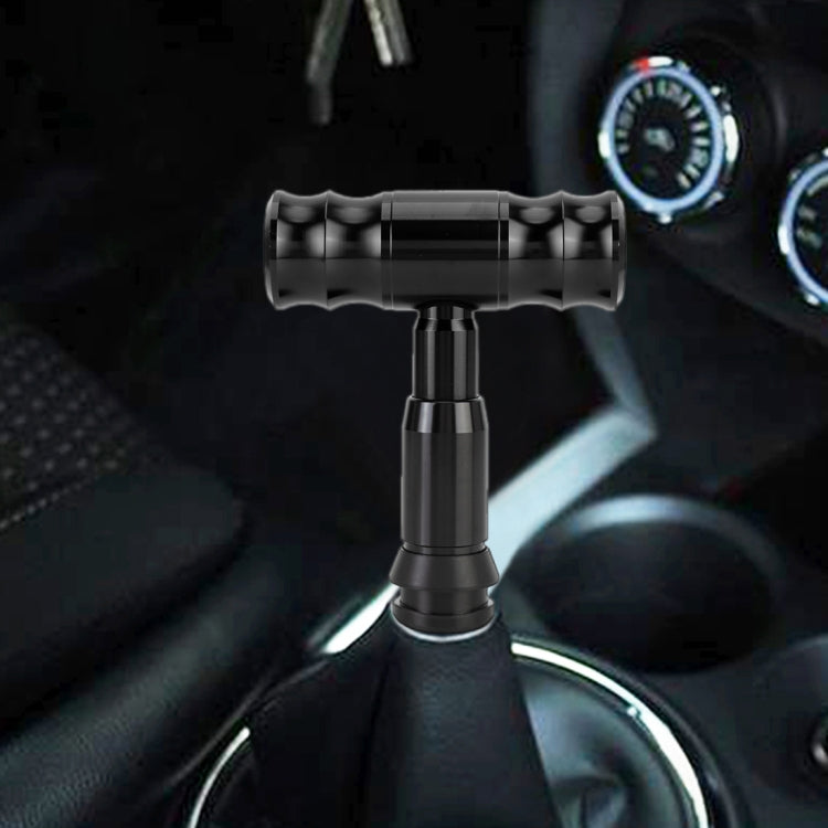 Black automatic gear shift knob installed on shifter with ribbed grip