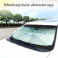 Car windshield sunshade, light mint tinted panel on dark frame for UV blocking.