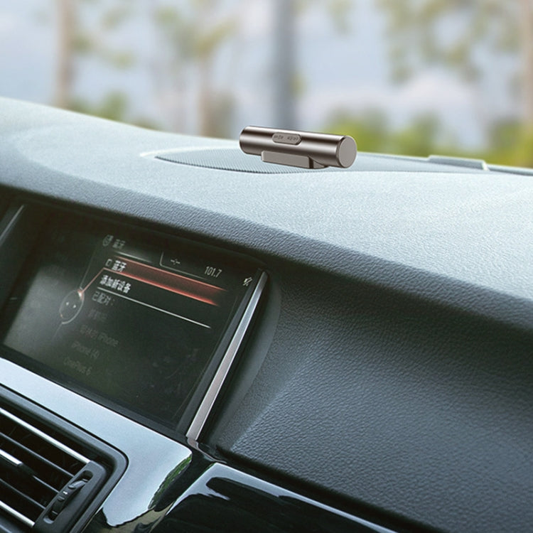 Metal parking number roller card mounted on car dashboard, digit window visible