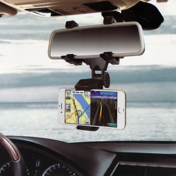 Car rearview mirror bracket with clamp holding a smartphone