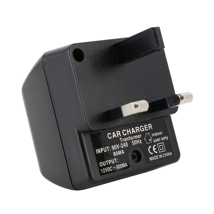 Black adapter with UK plug pins and charging label on back