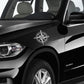 White compass rose decal on car door panel, with N W E S letters