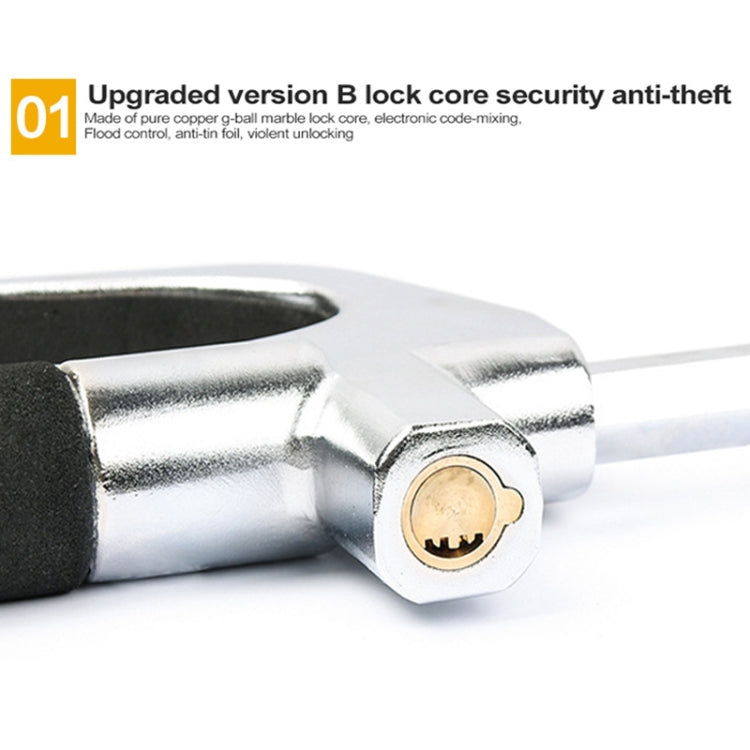 Steel steering wheel lock cylinder close-up with black rubber grip end
