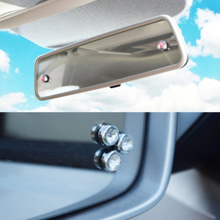 Car diamond sticker set with multiple pink crystal studs on interior mirror frame