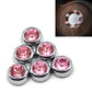 Car diamond sticker set with six pink faceted crystal studs in silver-tone rims