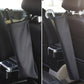 Black car umbrella storage bag shown on seat from front and side angles
