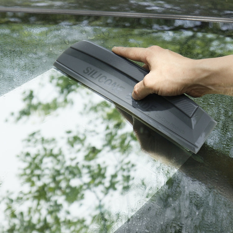 Gray I-shaped silicone car window scraper with textured blade and molded handle