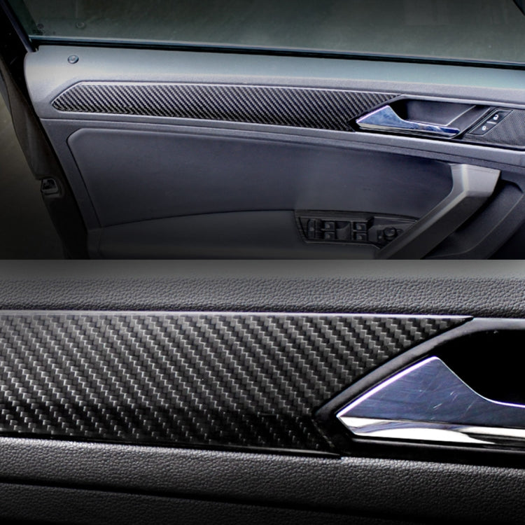 Carbon fiber door panel trim fitted near handle, dark woven finish