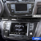 Installed black carbon fiber-look navigation frame trim around car display