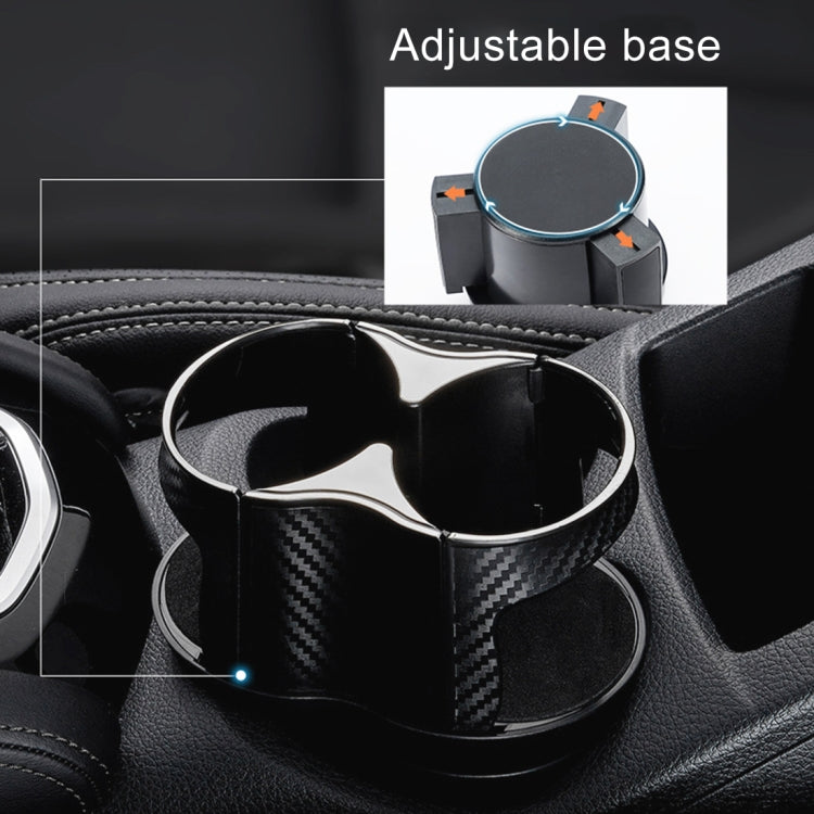 Adjustable black car cup holder with two openings and carbon-fiber style inserts