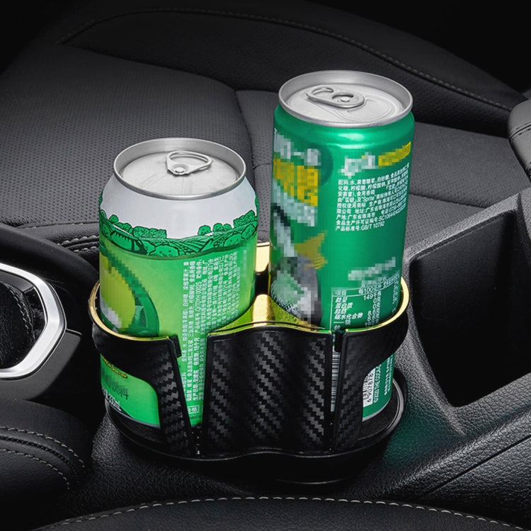 Two-slot car drink holder holding two cans; carbon-fiber style black base