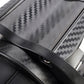 Close-up of carbon-fiber patterned car cup holder panel with slot opening