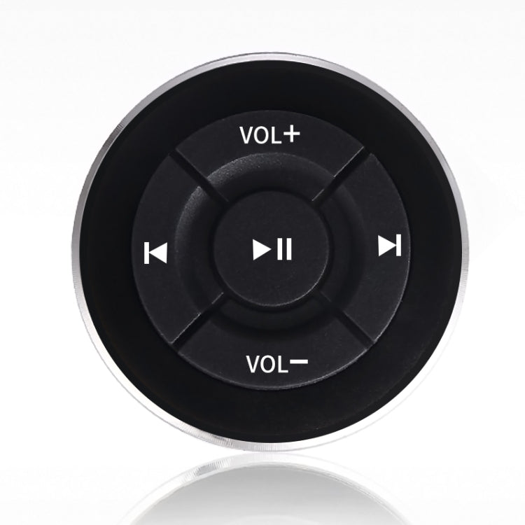 Round car Bluetooth remote with VOL+ and VOL- controls and play/pause button center