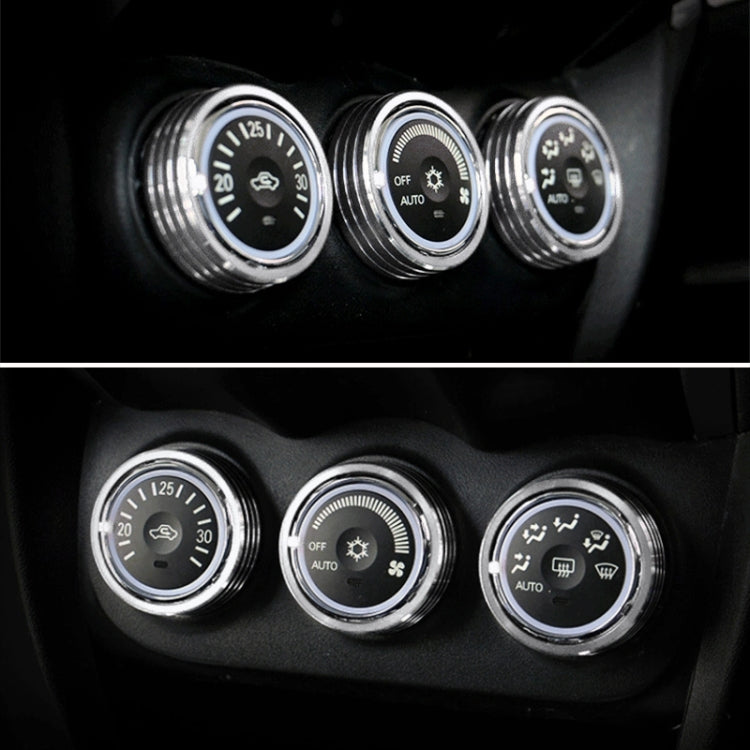 Car AC knob bezel rings, silver metal trim around three dashboard knobs