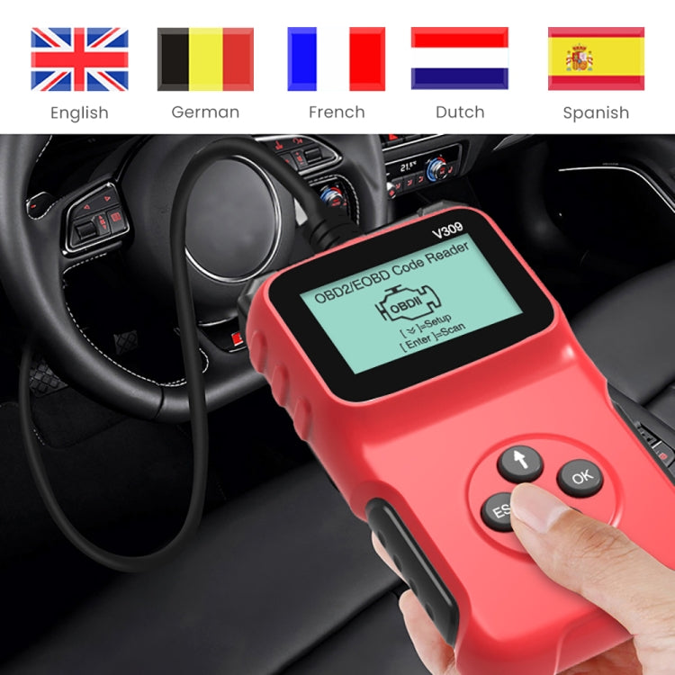Red OBD2 code reader in car interior with hand on buttons and LCD screen