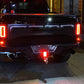 Square LED car light panel lit red on rear vehicle bumper