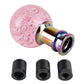 Pink acrylic gear shift knob with bubble texture plus rainbow adapter and black sleeves.