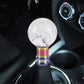 Clear white acrylic gear shift knob with bubble-like texture and rainbow metal base.