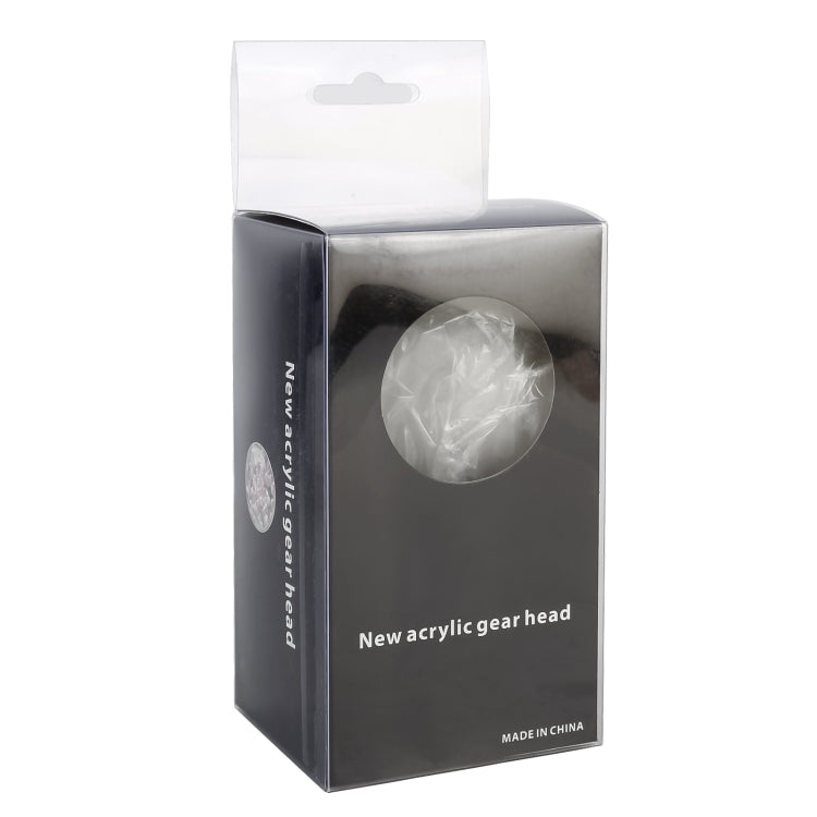 Boxed acrylic gear head for car, shown in retail packaging with clear knob window.