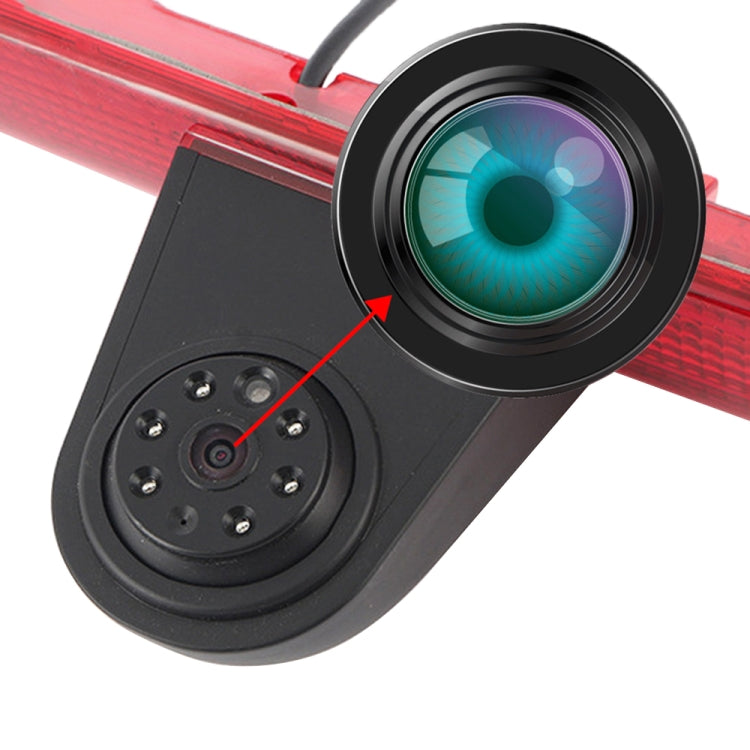 Close-up of the black camera lens housing on a red brake light frame