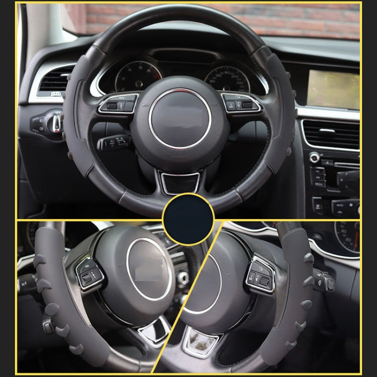 Black steering wheel spinner knob cover installed on steering wheel spokes