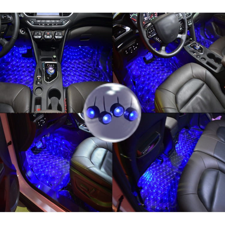 Car footwell illuminated with blue LED light glow under seats and center console